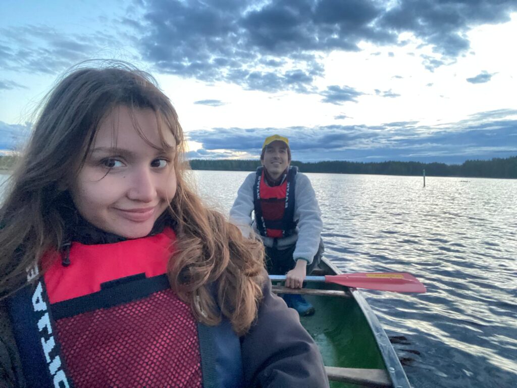 A girl and a boy in a boat on lake Kivijärvi.